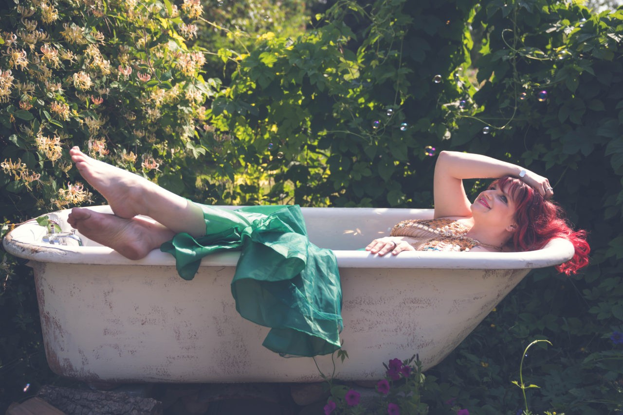 Mermaid woman in tub