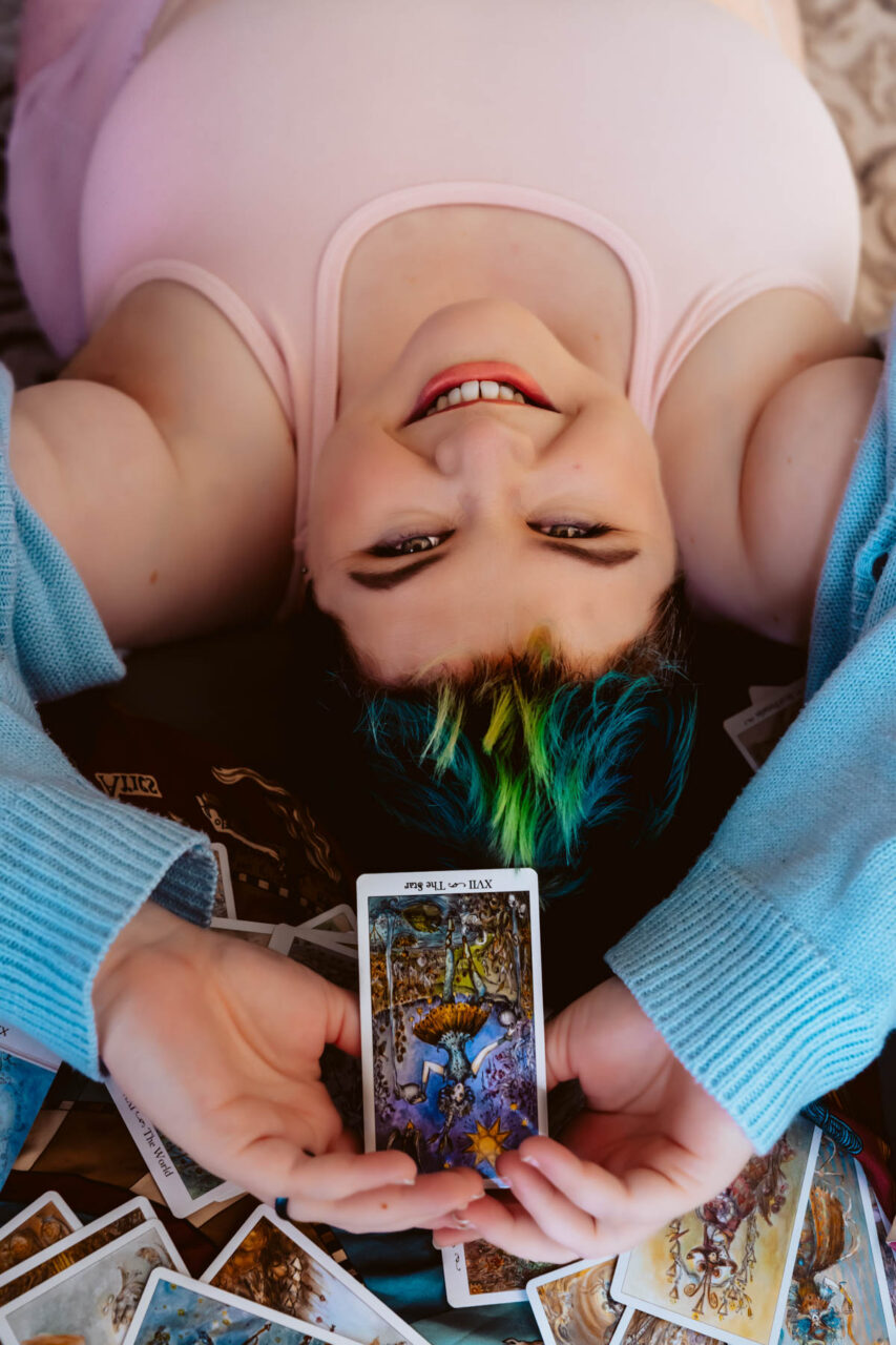 Tarot card boudoir session with plus size woman
